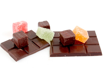 Colored Sweet.Jellies chocolate bonbons on a dark chocolate bar 