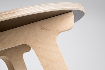 Underneath a Small Wooden Designer Stool or Small Round Table