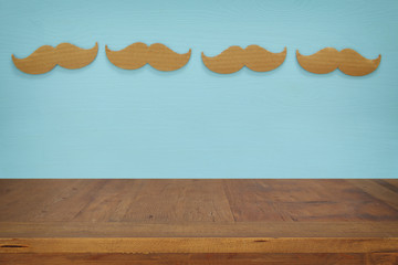 Empty table over paper mustache background. For product display