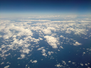 Fototapeta na wymiar Above the sky. Flying over clouds in plane. 