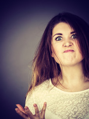 Attractive woman having angry frustrated face expression