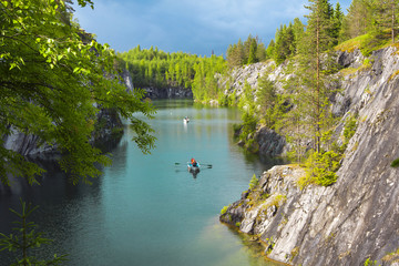 Karelia, Russia. View of the river, rocks, boats and canyon