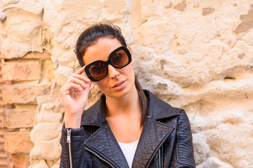 Fashion Portrait of a young woman in decayed European urban neig