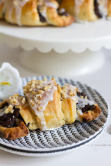 Poppy seeds croisssants. Traditional, polish croissants. White background, white wooden table and white plates.
