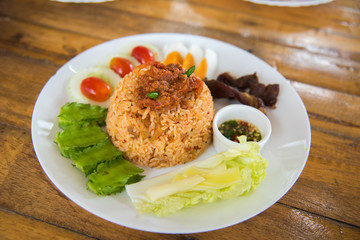 fried rice spicy sauce on top with vegetable