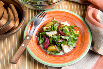Rustic salad with chicken, lettuce, potatoes, marinated onion, healthy lunch, tatsy