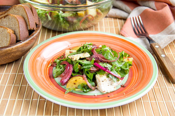 Rustic salad with chicken, lettuce, potatoes, marinated onion, healthy lunch, tatsy