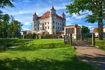 Fototapeta na wymiar Neo-Gothic style palace surrounded by an English landscape garden in Wojanow, Poland