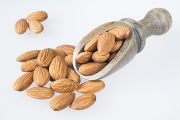 Almonds on the wooden spoon