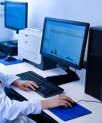 Woman entering computer data