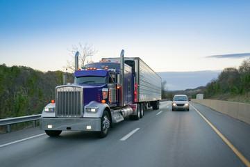Fototapeta na wymiar Semi 18-wheeler truck on highway