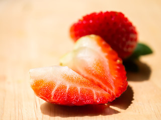 Close up of strawberry on wood.