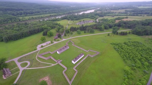 Aerial view of the Fort Frederick barracks with the Calvert Arms flag waving in the breeze.