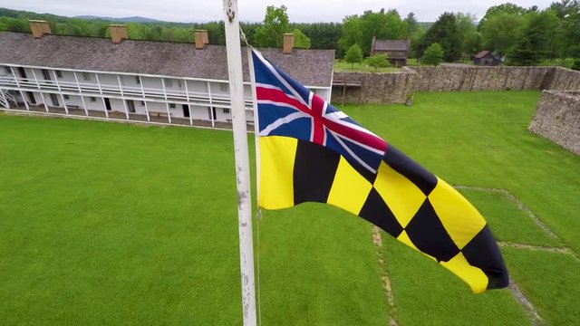 Aerial view of the Fort Frederick barracks with the Calvert Arms flag waving in the breeze.
