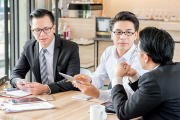 Businesspeople discussing together in conference room during meeting at office