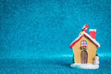 Fototapeta na wymiar Santa Claus sitting on roof with sparkling background. Christmas seasons celebration concept