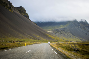 Driving the Iceland's Ring Road. Moving forward. Icelandic scenic landscape with mountains in the background. 