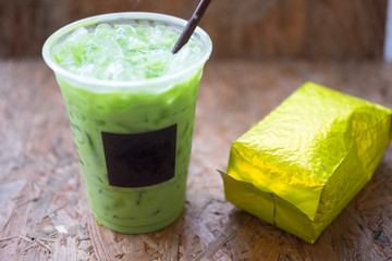 Ice green tea in clear plastic glass