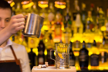 The bartender making cocktail