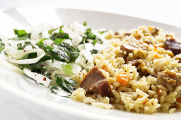 rice and mung bean pilaf accompanied with onion parsley salad