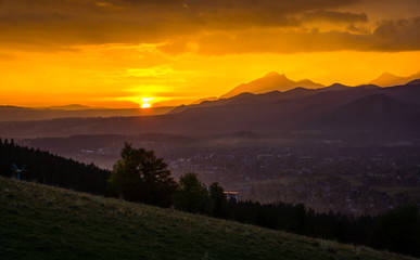 Sunset over peak Havran and Zakopane in Tatra mountains from Koscielisko, Poland