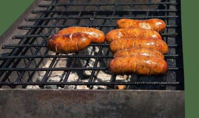 Grilled sausage on a grill.