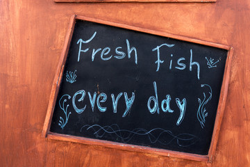 Handwritten sign at the restaurant - Fresh fish every day