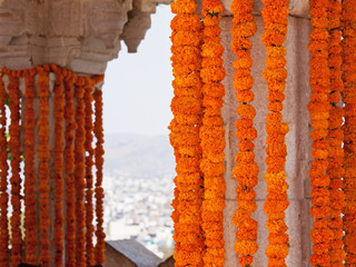 Hanging marigold flower decorations at a Hindu wedding celebration in Rajasthan, India 