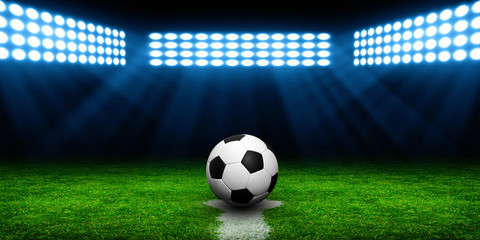 Soccer ball on green stadium