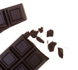 Broken chocolate bar isolated on white