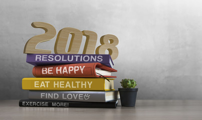 2018 happy new year. Resolutions, goals, start up, refresh concept. Wood numbers, books, quotes and cactus on wooden tabletop on loft wall background.