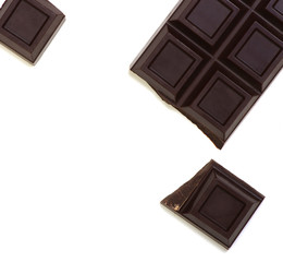 Broken chocolate bar isolated on white