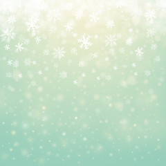 Christmas winter abstract background with snowflakes, bokeh lights and place for text. Christmas New Year's wallpaper