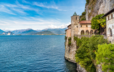 Fototapeta na wymiar Hermitage of Santa Caterina del Sasso is rock face directly overhanging the lake Maggiore, Leggiuno, Italy