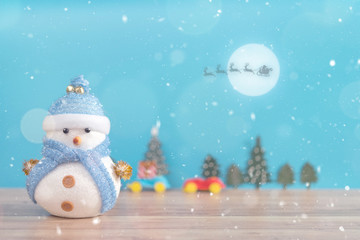 Happy snowman standing in winter christmas snow background. Merry christmas and happy new year greeting card with copy-space. Christmas celebration holiday background.