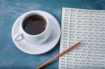 Blog, blog, blog- blogging concept on a notebook with cup of espresso coffee