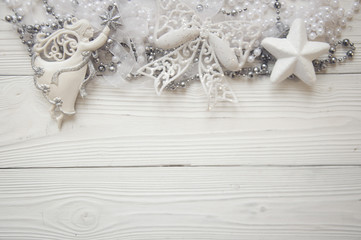 christmas background with holiday decorations on white wood background and copy space