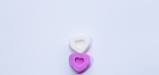 Two heart-shaped candies