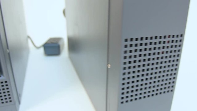 Front view of two grey UPS machines, emergency power source, backup battery 