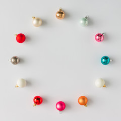 Colorful Christmas baubles decoration on bright background. Flat lay. Holiday concept.