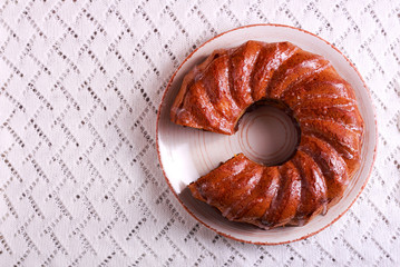 Ring cake on plate, over napkin