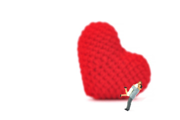 Selective focus miniature couple lover jumping hug action happy family time.