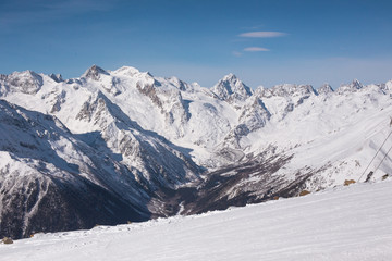 Winter mountains with high peaks.