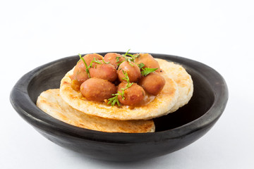 Traditional Colombian arepa topped with beans