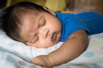 Obraz na płótnie Canvas Cute asian baby sleeping