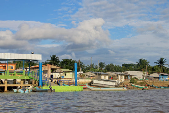 Traditional fishing boats and houses, Cayapas River, Esmeraldas province, Ecuador, South America