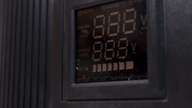 Voltage converter display during restart, close-up of power transformer booting