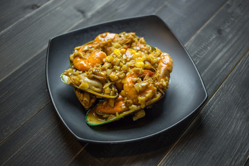 Koong tung, Spicy Shrimp and mixed seafood, Thai Style Spicy shrimps with Garlic on wood