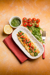 tofu salad with tomatoes marinated with arugula pesto and lemon