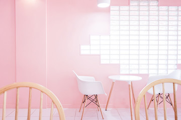 pink room with with chair and table